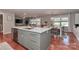 Modern kitchen features quartz countertops, white cabinets, stainless appliances, and a large island at 737 Waverly Pl, Statesville, NC 28677