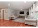 Cozy living room with hardwood floors, neutral tones, and large windows allowing for plenty of light at 737 Waverly Pl, Statesville, NC 28677
