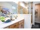 Modern bathroom with a glass shower and a vanity with a sink at 7936 Cedarsmith Ct, Charlotte, NC 28217