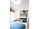 A bedroom with colorful bedding and modern decor at 7936 Cedarsmith Ct, Charlotte, NC 28217