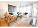 This living room features a fireplace, two leather chairs and white sofa with decorative pillows at 7936 Cedarsmith Ct, Charlotte, NC 28217