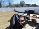 Spacious fenced backyard with an outdoor seating area and ample room for activities at 8112 Clairwood Dr, Charlotte, NC 28269