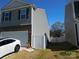 Well-maintained home exterior with vinyl siding and a view of the fenced backyard at 8112 Clairwood Dr, Charlotte, NC 28269