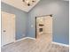 Bedroom featuring high ceilings, modern lighting, an entrance, and wood-look flooring at 825 Potneck Rd, Salisbury, NC 28147