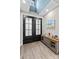 Inviting foyer featuring a double-door entrance, neutral walls, and a charming console table at 825 Potneck Rd, Salisbury, NC 28147