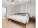 Cozy bedroom featuring modern decor, ceiling fan, and hardwood flooring at 8260 Waxhaw Hwy, Waxhaw, NC 28173