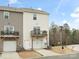 Two-story townhome featuring attached garage and wood balcony, with neutral vinyl siding at 8260 Waxhaw Hwy, Waxhaw, NC 28173