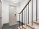 Foyer with stylish tile flooring and modern staircase at 8260 Waxhaw Hwy, Waxhaw, NC 28173