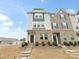 Townhome features brick detail and stairs leading up to a front entrance at 8260 Waxhaw Hwy, Waxhaw, NC 28173