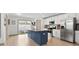 Open concept kitchen with stainless steel appliances, island with seating and granite countertops at 8260 Waxhaw Hwy, Waxhaw, NC 28173