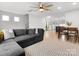Spacious living room with contemporary design, a stylish rug, and a large gray sofa at 8260 Waxhaw Hwy, Waxhaw, NC 28173