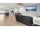 Open-concept living area flowing to kitchen, featuring stainless steel appliances and an island at 8260 Waxhaw Hwy, Waxhaw, NC 28173