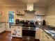 Well-equipped kitchen features a stainless steel gas range and granite countertops at 842 E Woodlawn Rd, Charlotte, NC 28209