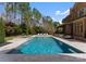 Sparkling pool and spa with outdoor seating, set against a backdrop of lush greenery at 9101 Clerkenwell Dr, Waxhaw, NC 28173