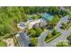 Community amenities including a pool, tennis courts, a playground, and a parking lot surrounded by lush greenery at 1119 Lytton Ln, Matthews, NC 28104