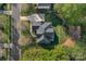 Aerial view of a home with a well-maintained roof, landscaping, and a serene neighborhood setting at 1119 Lytton Ln, Matthews, NC 28104