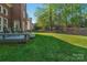 Scenic backyard with a deck, lush lawn, and beautiful landscaping, perfect for outdoor enjoyment at 1119 Lytton Ln, Matthews, NC 28104