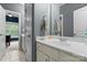 Bright bathroom includes a sink, mirror, and doorways to the bedroom and a separate toilet room at 1119 Lytton Ln, Matthews, NC 28104