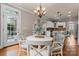 Breakfast area next to kitchen features a table and chairs with a view of the kitchen area at 1119 Lytton Ln, Matthews, NC 28104
