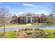 Elegant brick clubhouse with manicured lawns, flowerbeds, and well-maintained landscaping at 1119 Lytton Ln, Matthews, NC 28104
