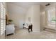 Well-lit hallway with a cushioned bench and dresser that could be used as a bonus room at 1119 Lytton Ln, Matthews, NC 28104