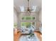 Spacious living room with high ceilings, skylights, a ceiling fan, and large windows at 1119 Lytton Ln, Matthews, NC 28104