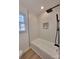 Updated bathroom with subway tile surround and a modern shower head at 112 Greentree Dr, Mount Holly, NC 28120