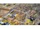 Aerial view of a wooded lot, framed in white, featuring a modern white two-story home at 126 Orville Rd, Statesville, NC 28677