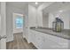 Bathroom with a granite countertop vanity and view into the room through a doorway at 126 Orville Rd, Statesville, NC 28677