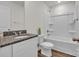 Bathroom featuring granite vanity, white cabinets, shower-tub, and gray flooring at 126 Orville Rd, Statesville, NC 28677