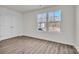 Bedroom with natural light, modern flooring, and a closet at 126 Orville Rd, Statesville, NC 28677