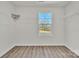 Walk-in closet featuring wire shelving and a window with a view of the trees at 126 Orville Rd, Statesville, NC 28677