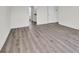 Spacious living room with gray wood flooring and white walls at 126 Orville Rd, Statesville, NC 28677