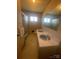 Bathroom featuring dual sinks, tiled shower, and a vintage aesthetic at 1403 Oakwood Ave, Kannapolis, NC 28081