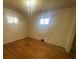 Cozy bedroom featuring hardwood floors and natural light from two windows at 1403 Oakwood Ave, Kannapolis, NC 28081