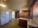 Well-lit kitchen with a refrigerator and an open doorway to another room at 1403 Oakwood Ave, Kannapolis, NC 28081