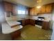 A view of a retro kitchen with vintage cabinetry and linoleum floor at 1403 Oakwood Ave, Kannapolis, NC 28081