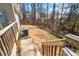 Backyard featuring a wooden fence, AC unit, grass, and a view of the surrounding neighborhood at 154 Limerick Rd # D, Mooresville, NC 28115