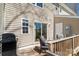 Outdoor deck with a grill, outdoor seating, a wooden railing, and exterior siding at 154 Limerick Rd # D, Mooresville, NC 28115