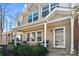 Charming front porch featuring cozy seating and a well-maintained landscape at 154 Limerick Rd # D, Mooresville, NC 28115