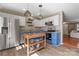 Kitchen with stainless appliances, blue cabinetry, and a movable kitchen island at 154 Limerick Rd # D, Mooresville, NC 28115