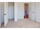 Neutral bedroom features a closet with bi-fold doors and doorway, offering a cozy and functional space at 1829 Augustine St, Monroe, NC 28112