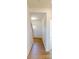 Bright hallway features hardwood flooring, leading to the front door and stairs, with a view into another room at 1829 Augustine St, Monroe, NC 28112