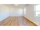 Expansive living room with hardwood flooring, recessed lighting, and large windows offering ample natural light at 1829 Augustine St, Monroe, NC 28112