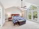 This bedroom is spacious and has a large window that lets in natural light at 1916 Dugan Dr, Charlotte, NC 28270