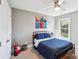 This bedroom has a ceiling fan, a guitar, a window, and carpeted floors at 1916 Dugan Dr, Charlotte, NC 28270