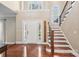 Bright foyer with hardwood floors, staircase, and a soaring ceiling welcomes you home at 1916 Dugan Dr, Charlotte, NC 28270