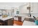 Modern kitchen with white cabinets, stainless steel appliances, and hardwood floors is ready for cooking at 1916 Dugan Dr, Charlotte, NC 28270