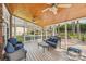 Inviting screened porch with wood ceiling, comfortable seating, and views of the backyard at 1916 Dugan Dr, Charlotte, NC 28270