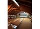 Unfinished attic space with exposed wooden beams and insulation at 1963 Wexford Ct, Gastonia, NC 28054